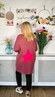 Rose pink Loose fitting free size jumper with star detail on both sleeves and back worn with chocolate magic trousers and chocolate sneakers
