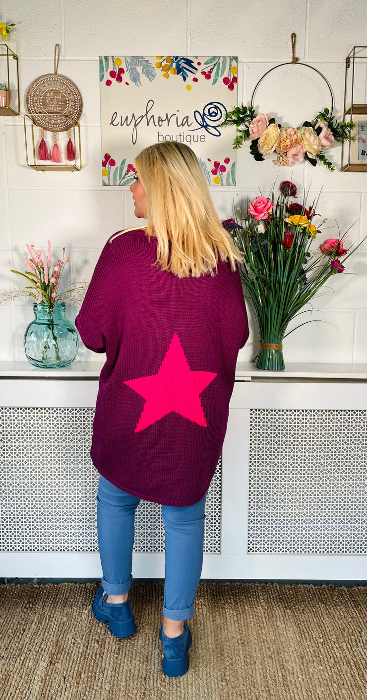 Plum Loose fitting free size jumper with star detail on both sleeves and back worn with denim magic trousers and Blue loafers