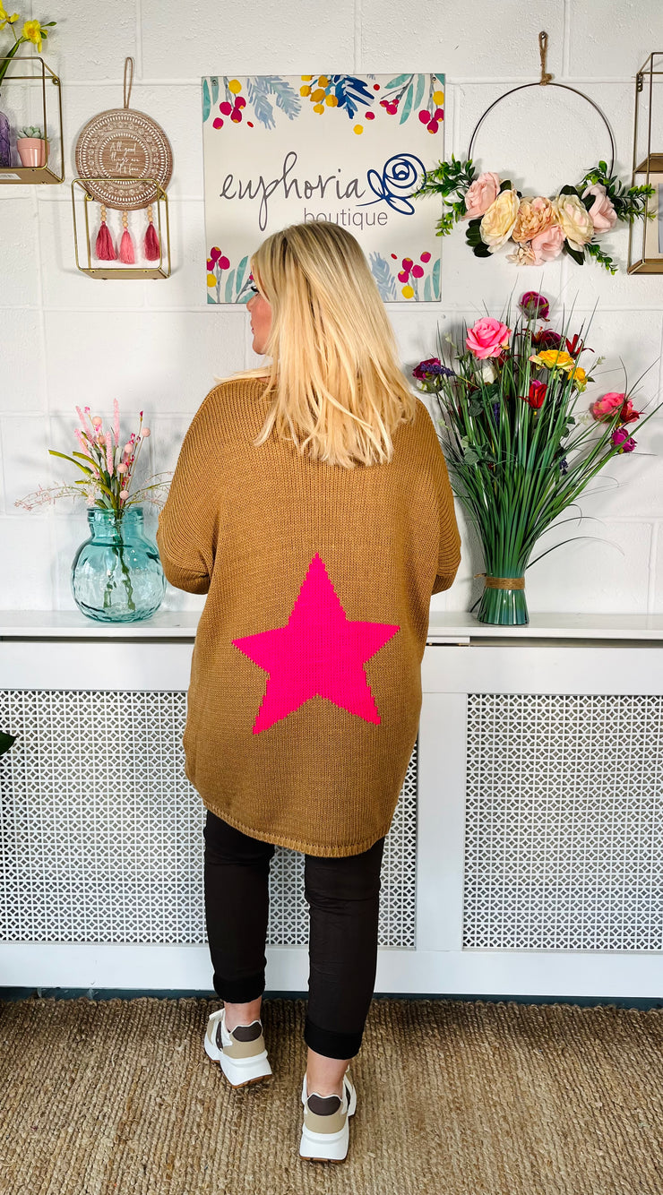 Tan Loose fitting free size jumper with star detail on both sleeves and back worn with chocolate magic trousers and Chocolate sneakers