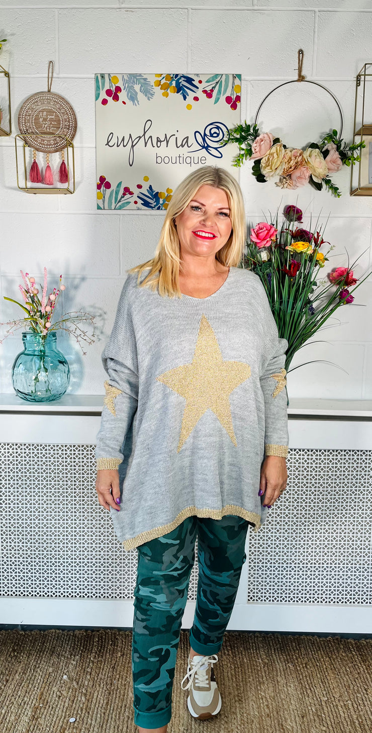 Ladies grey loose fitting free size jumper with sparkle star on front and sleeves with a sparkle trim cuff and hem