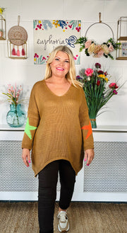 Tan Loose fitting free size jumper with star detail on both sleeves and back worn with chocolate magic trousers and Chocolate sneakers