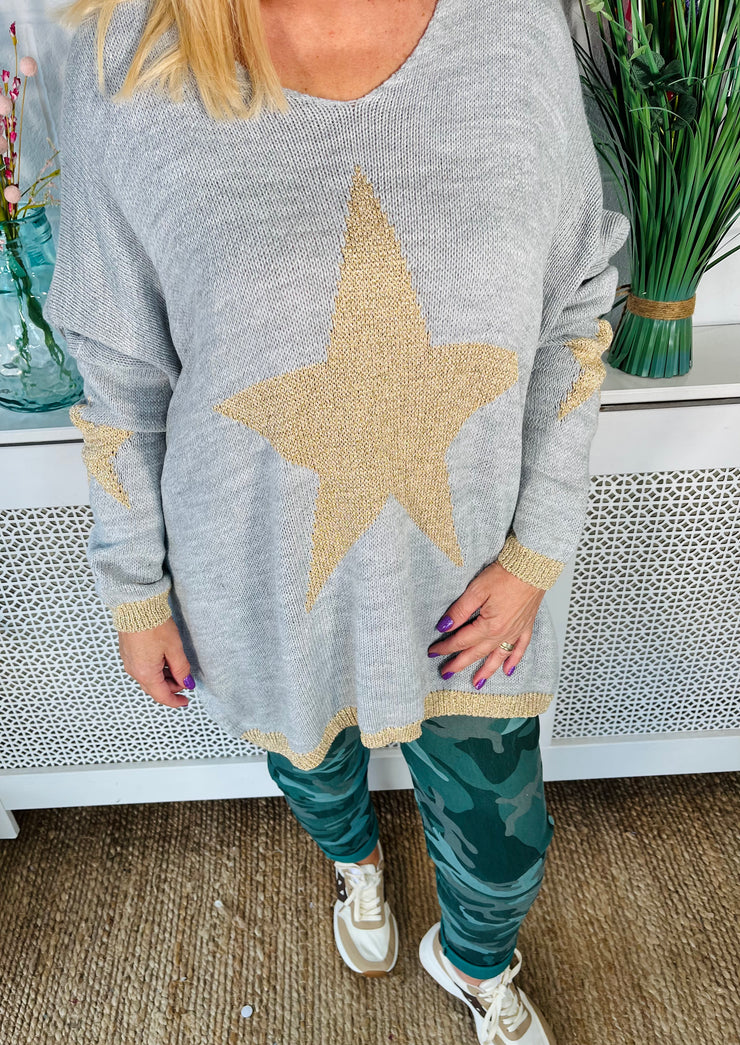 Ladies grey loose fitting free size jumper with sparkle star on front and sleeves with a sparkle trim cuff and hem