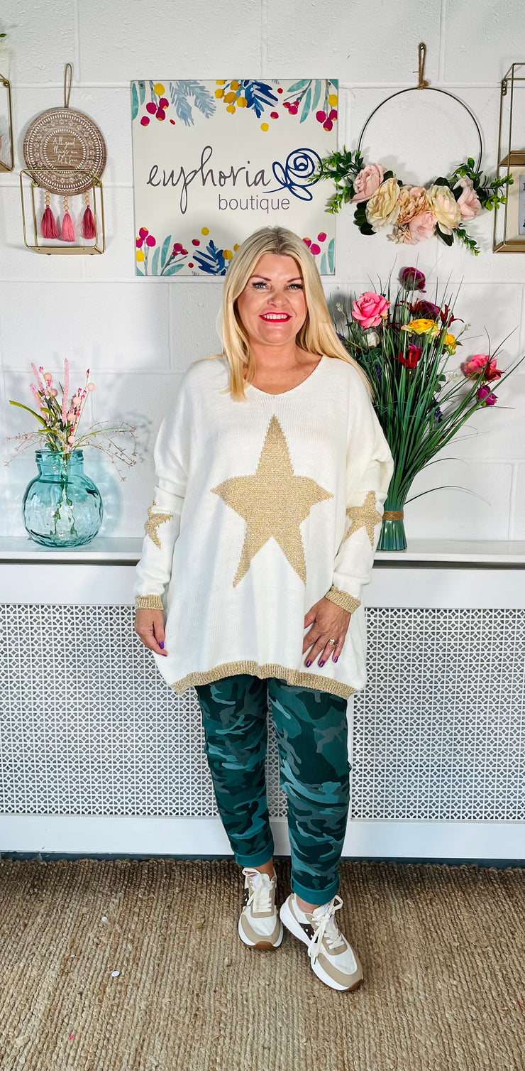 Ladies winter white loose fitting free size jumper with sparkle star on front and sleeves with a sparkle trim cuff and hem