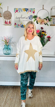 Ladies winter white loose fitting free size jumper with sparkle star on front and sleeves with a sparkle trim cuff and hem