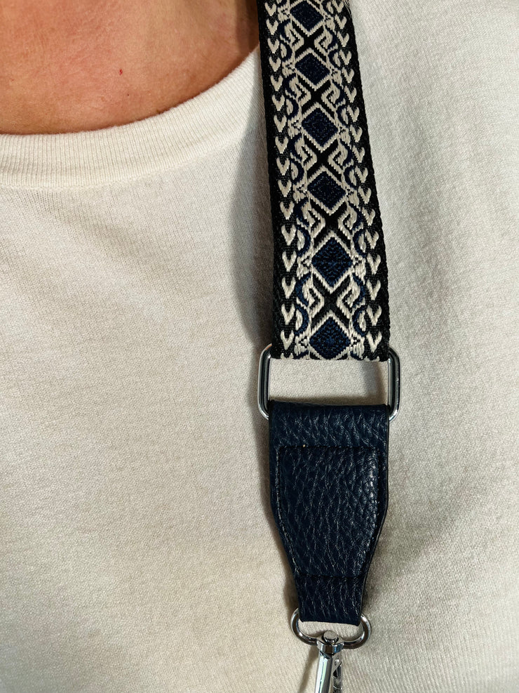 close up photo of the sling bags patterned adjustable strap 