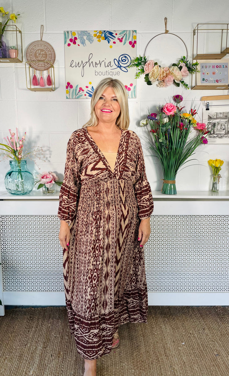 Tan patterned midi dress with v neckline and floaty sleeves