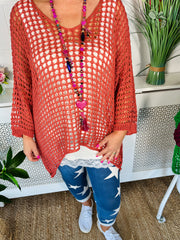 Close up of Blush Crochet Over Top Worn with star print denim joggers and white sock trainers